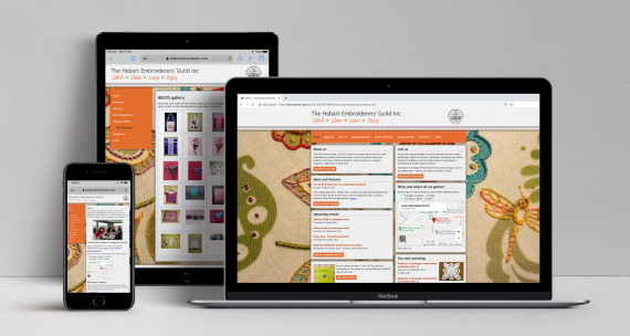 Hobart Embroiderer's Guild semi-responsive website displayed on three devices: a laptop, a tablet and a mobile phone.